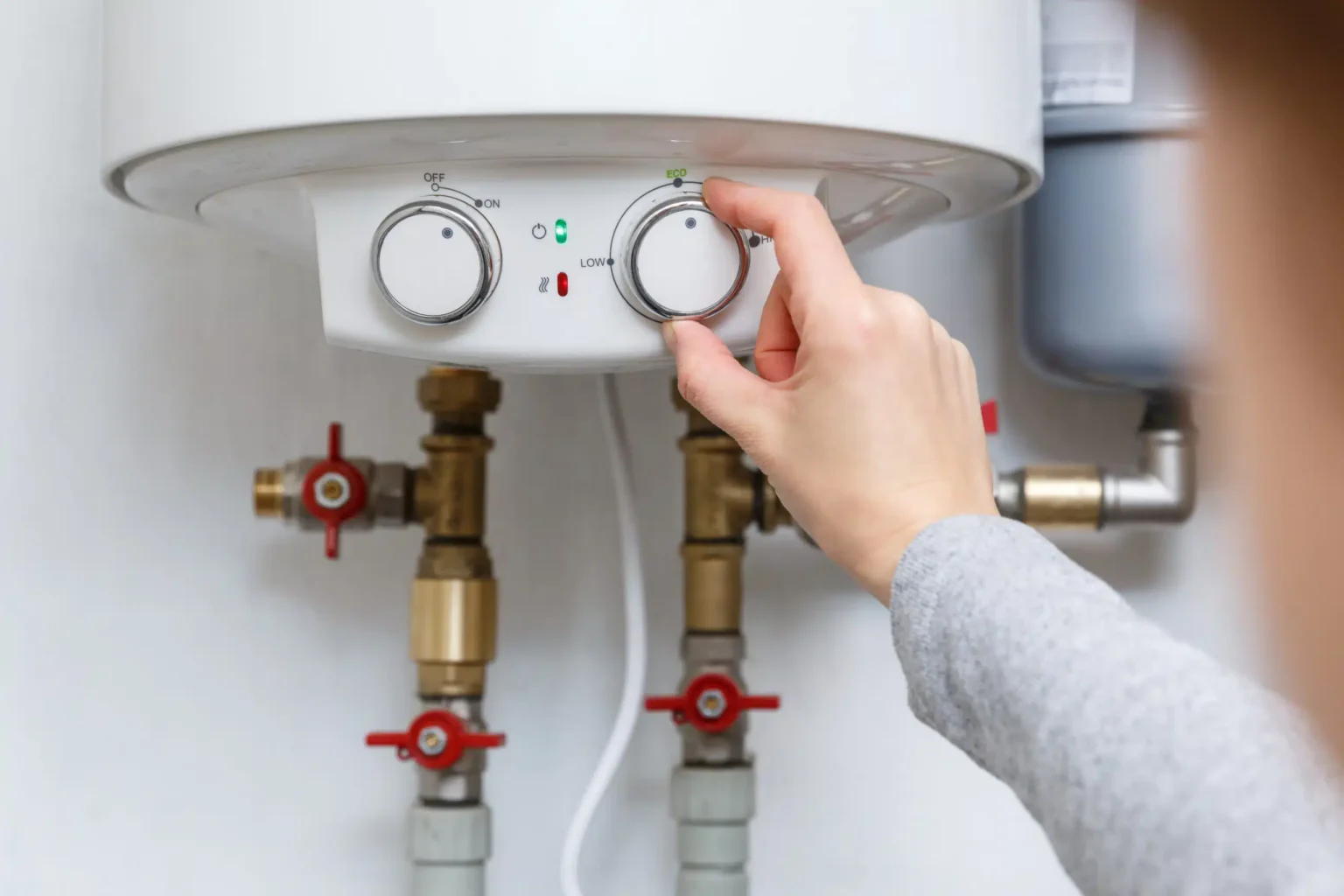 Technician adjusting a water heater in Moorpark